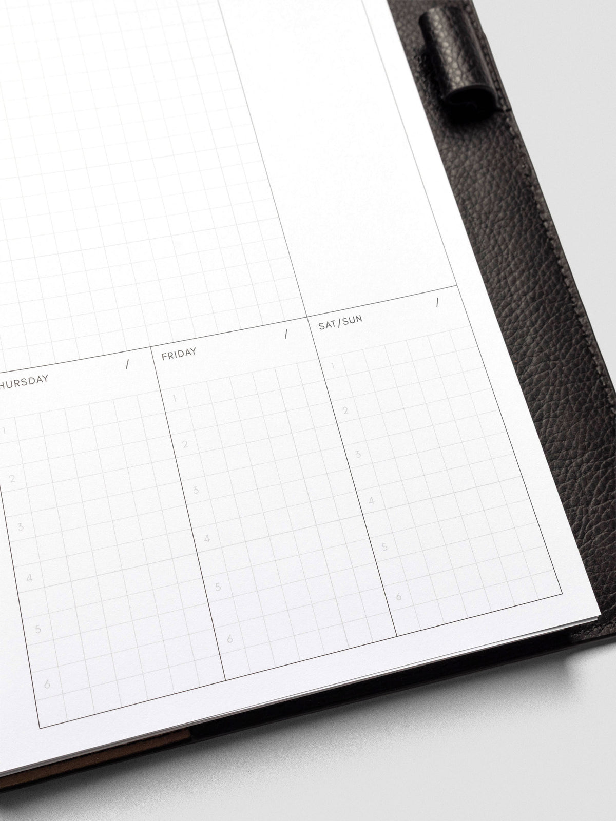 A clean view of the Friday and Saturday/Sunday sections of the planner insert, unfilled and ready for use, showcasing the six-line structure.