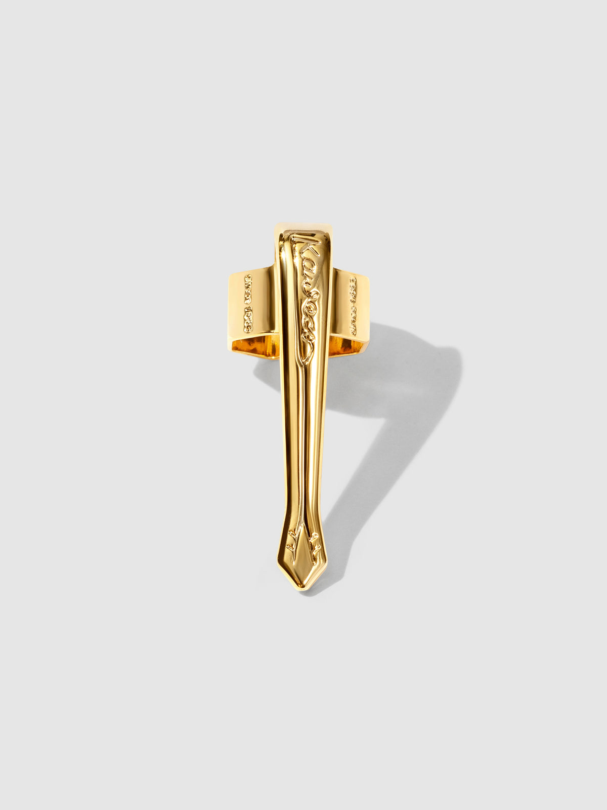 Nostalgic gold clip displayed on a neutral background.