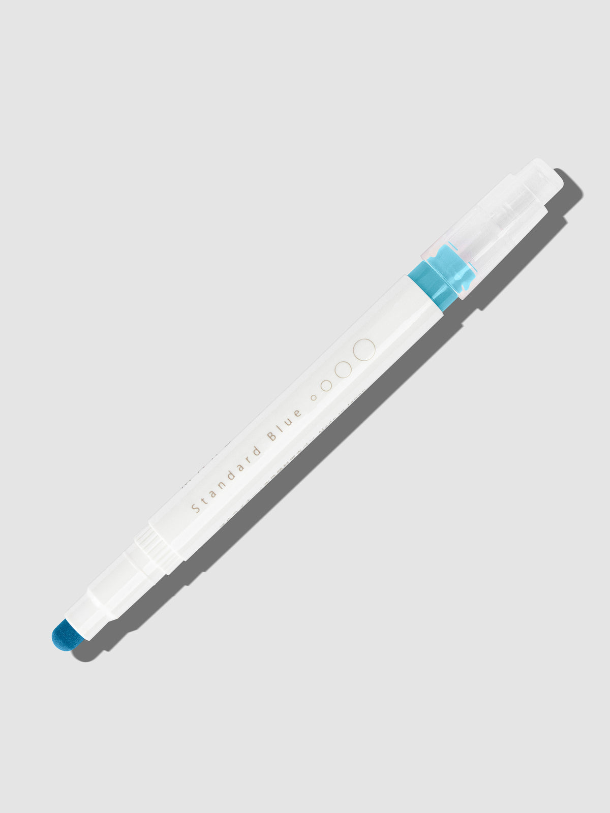 Standard Blue highlighter with tip exposed and cap posted to the end of its barrel on a neutral background.
