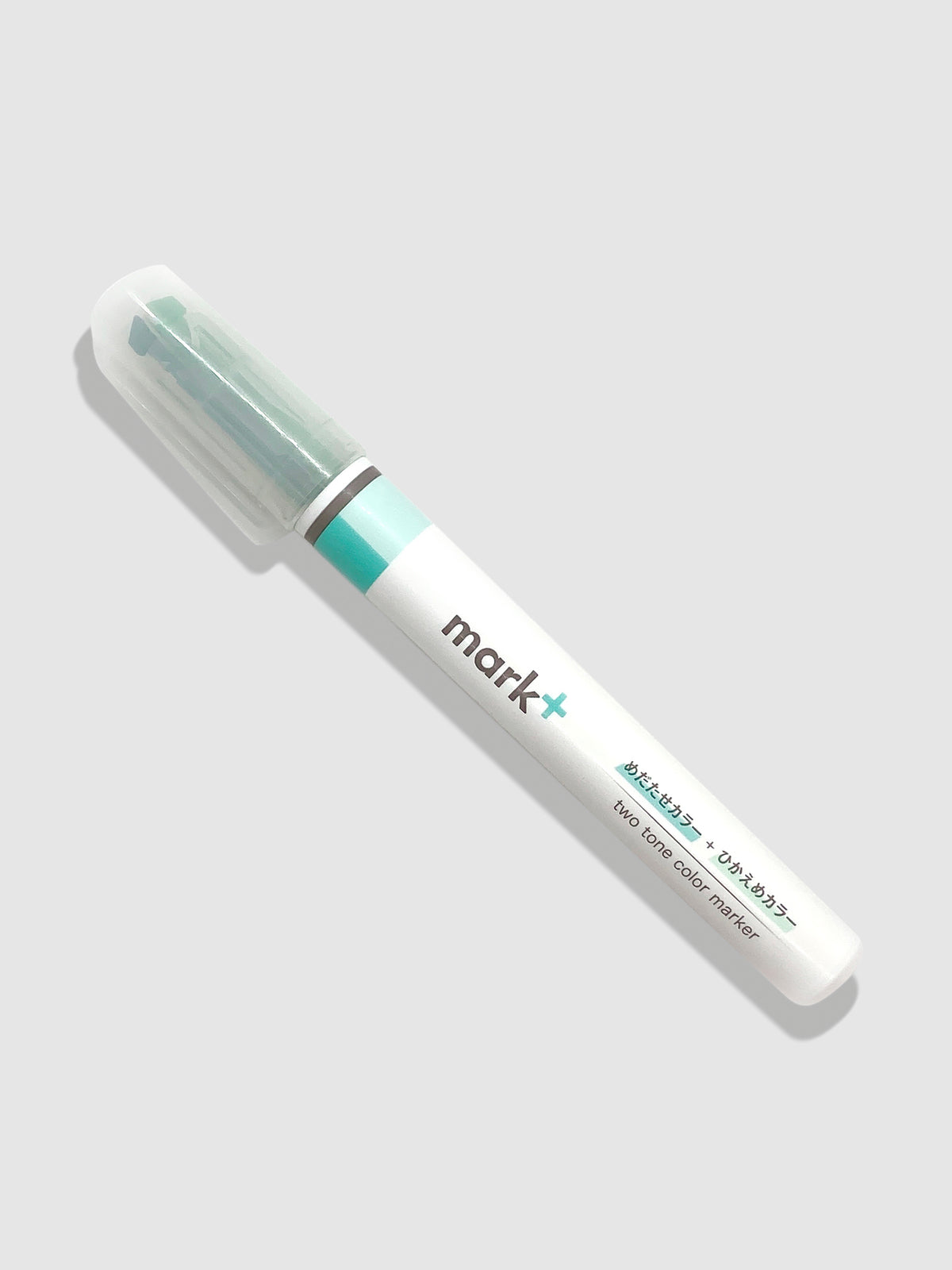 Kokuyo Mark Plus Two Tone Highlighter in Green turned to the left against a neutral background.