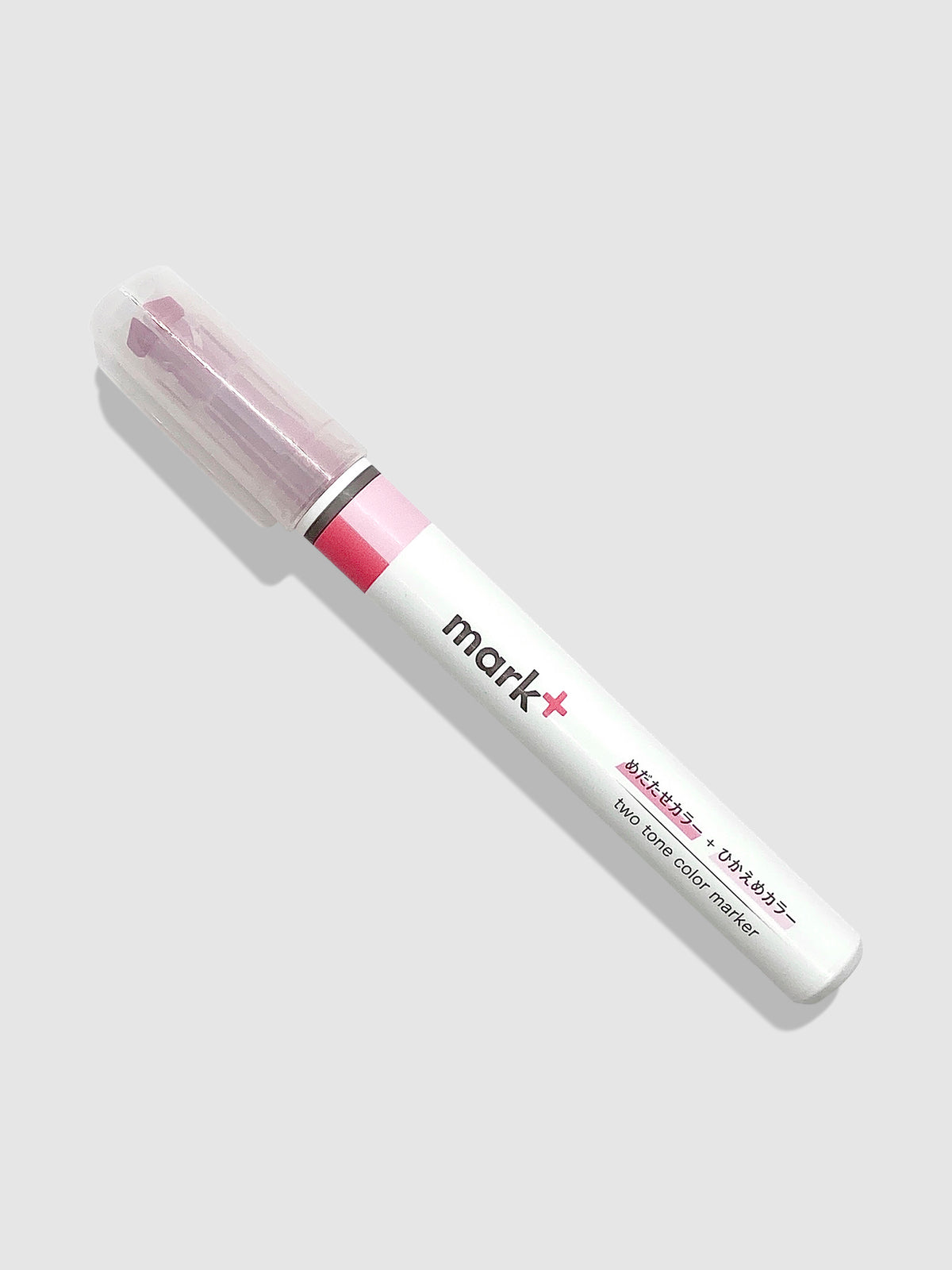 Kokuyo Mark Plus Two Tone Highlighter in Pink turned to the left against a neutral background.