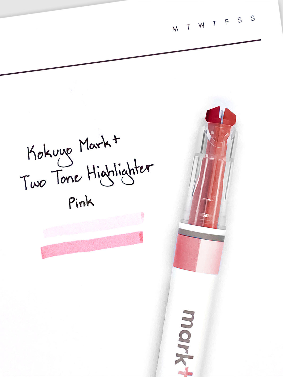 Highlighter resting on a sheet of paper displaying highlight samples from both nibs and ink colors.