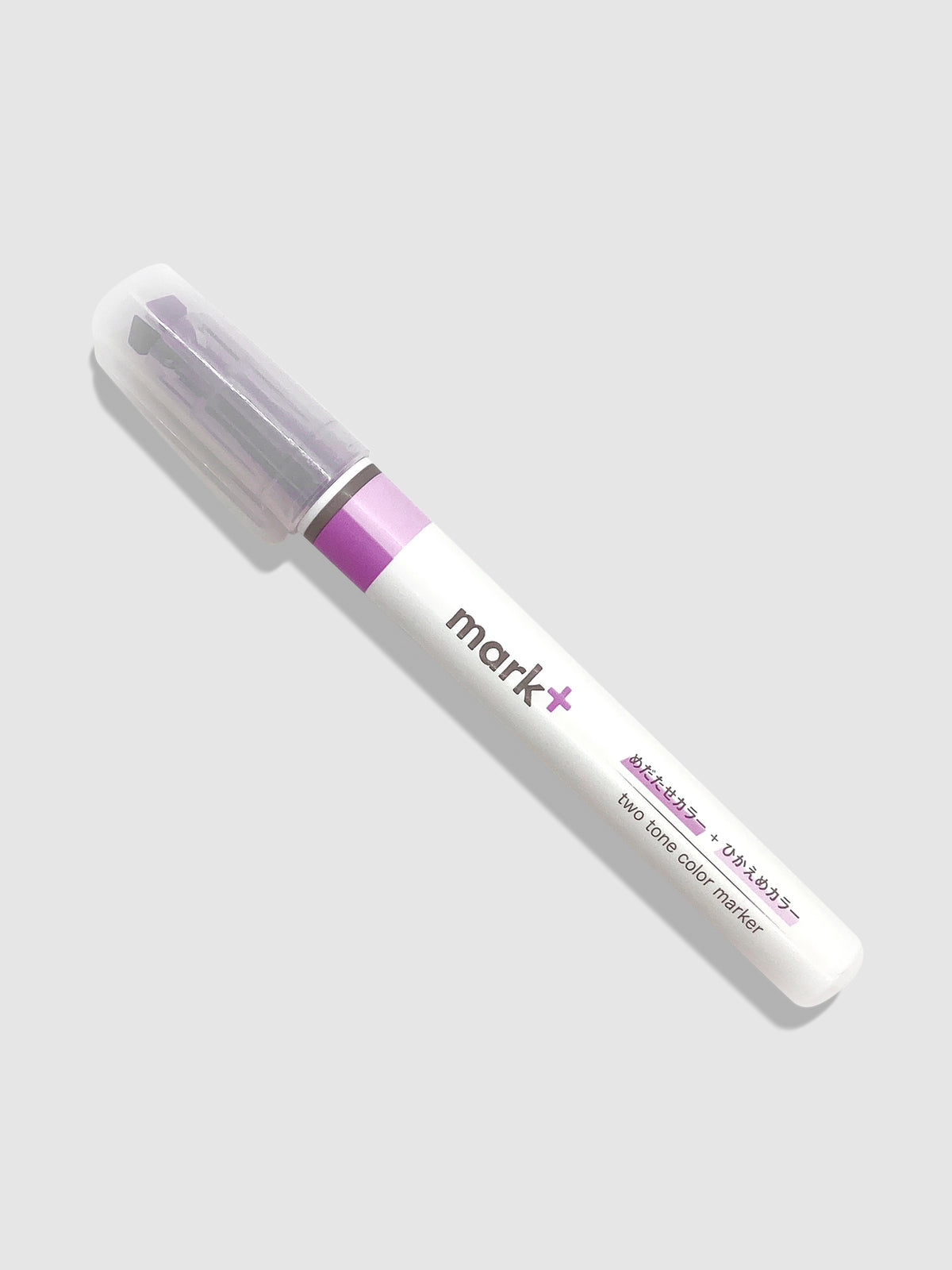 Kokuyo Mark Plus Two Tone Highlighter in Purple turned to the left against a neutral background.