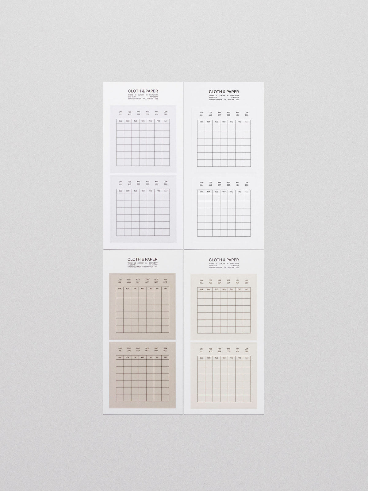 Four sheets of Cloth & Paper Label Planner Stickers titled "Calendar," displayed on a light grey background. Each sheet features minimalist grid calendar stickers in neutral tones, with the months listed at the top and a Sunday-to-Saturday grid layout below for flexible monthly planning.