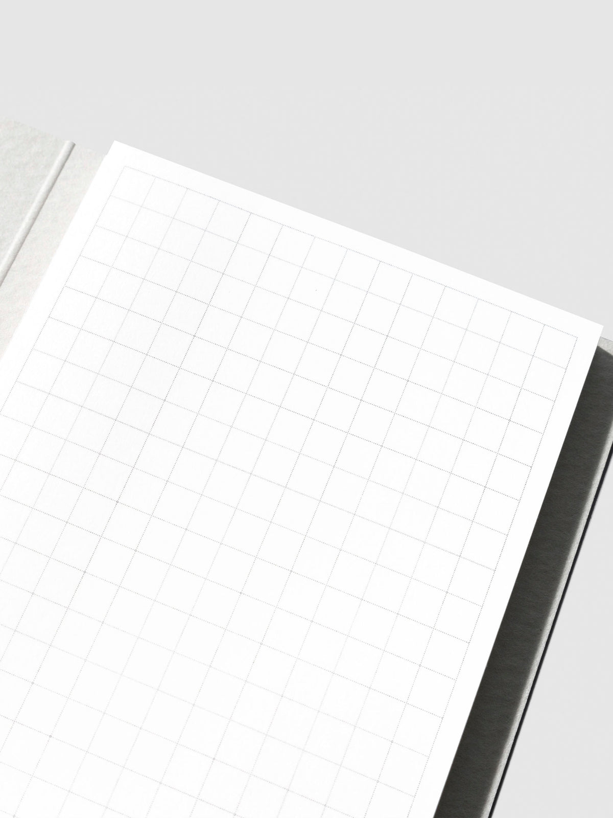 Closeup of sticky note in its packaging displayed on a neutral background.