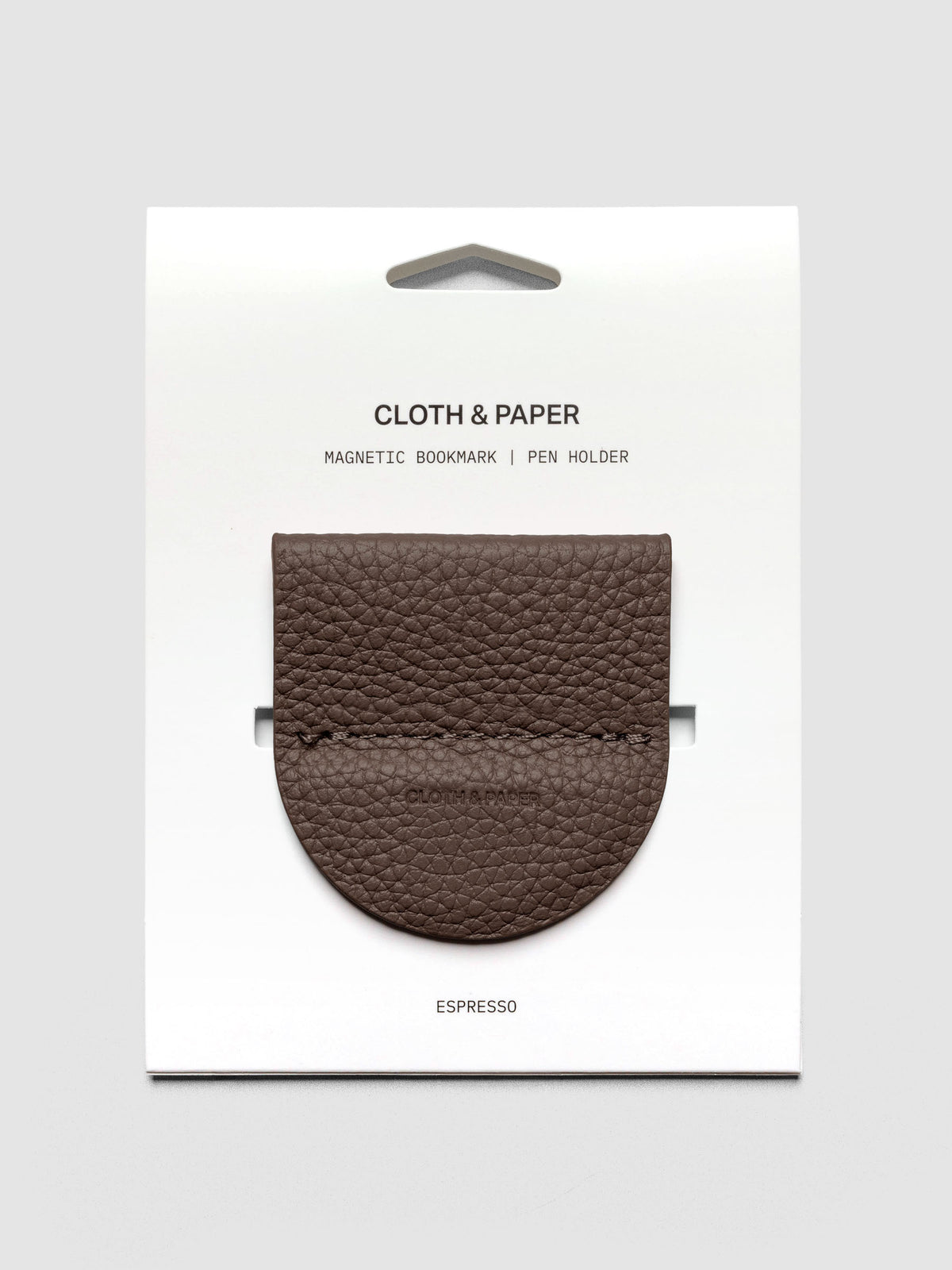 Magnetic Bookmark | Pen Holder in Espresso, a dark brown, displayed on a white backing card against a neutral background.