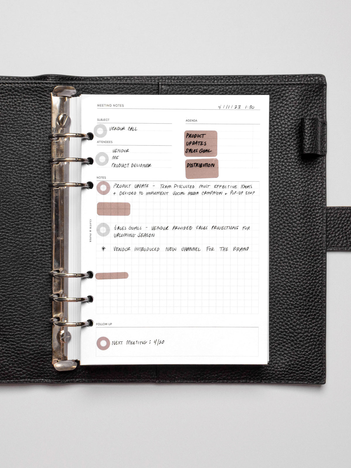 Insert in use inside a black leather planner.