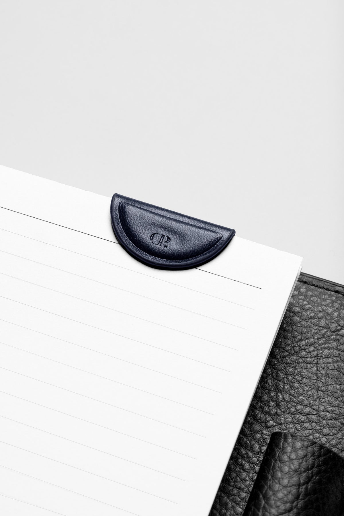 Mini Magnetic Bookmark in the color Apollo attached to the inside of a planner.