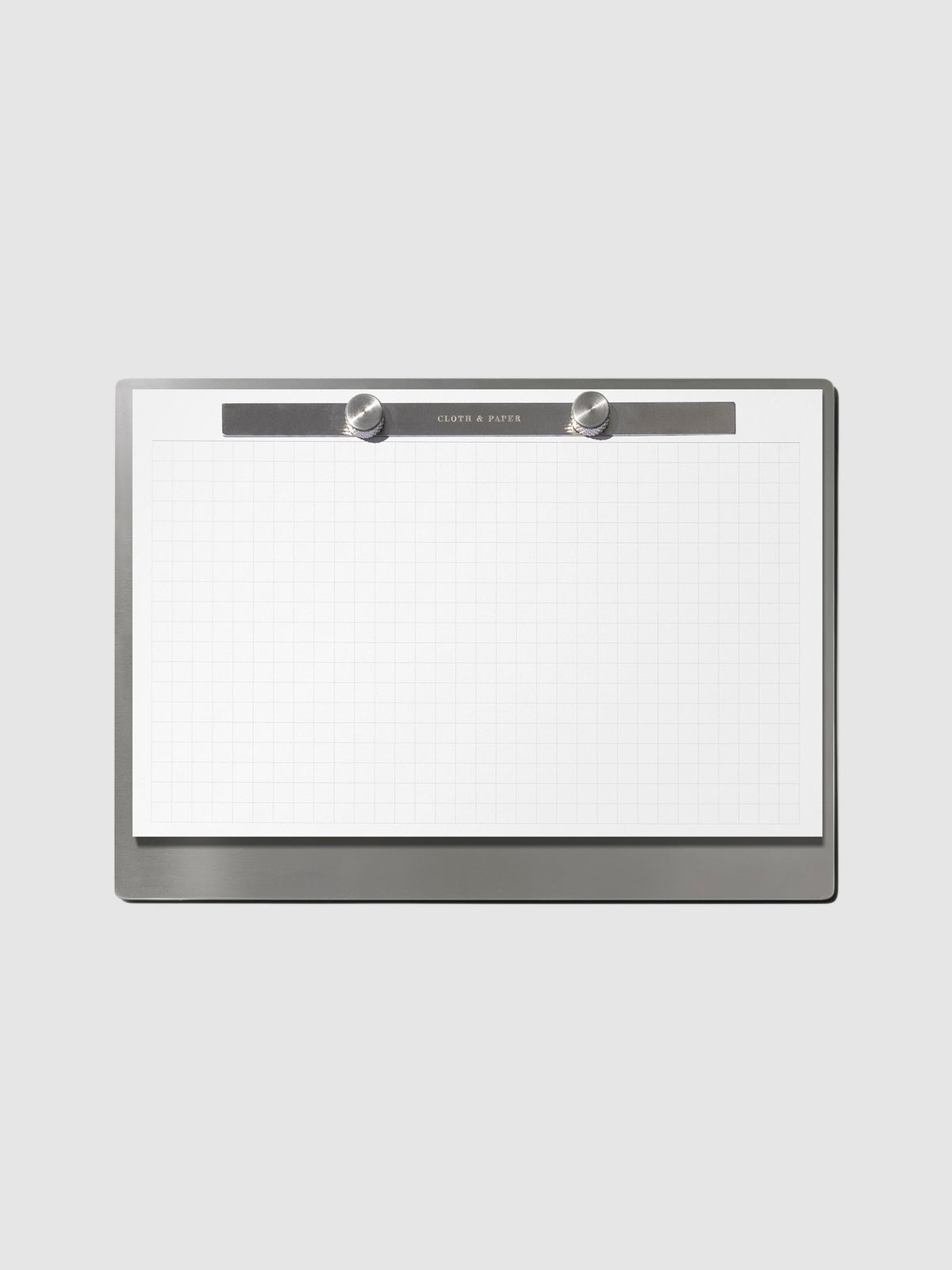 Modern Bound Notepad Insert Refills, graph, filled on the Modern Bound Notepad board, resting on a neutral background