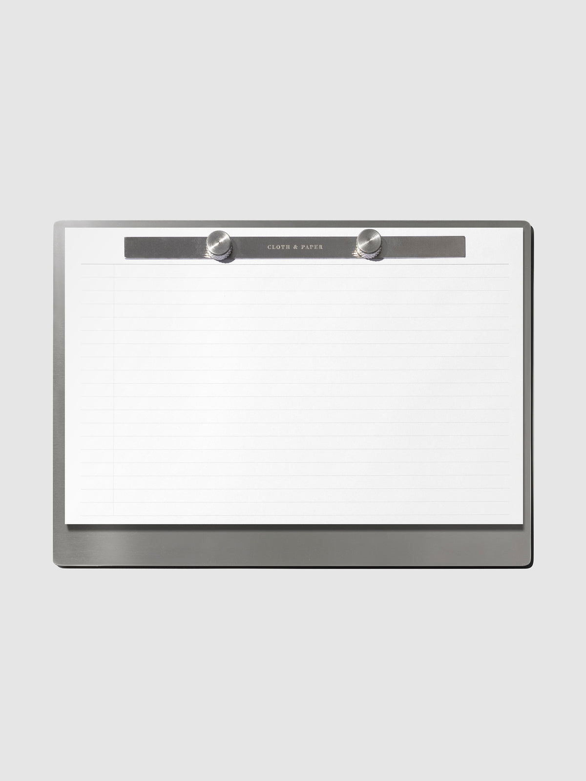 Modern Bound Notepad Insert Refills, lined, filled on the Modern Bound Notepad board, resting on a light gray background