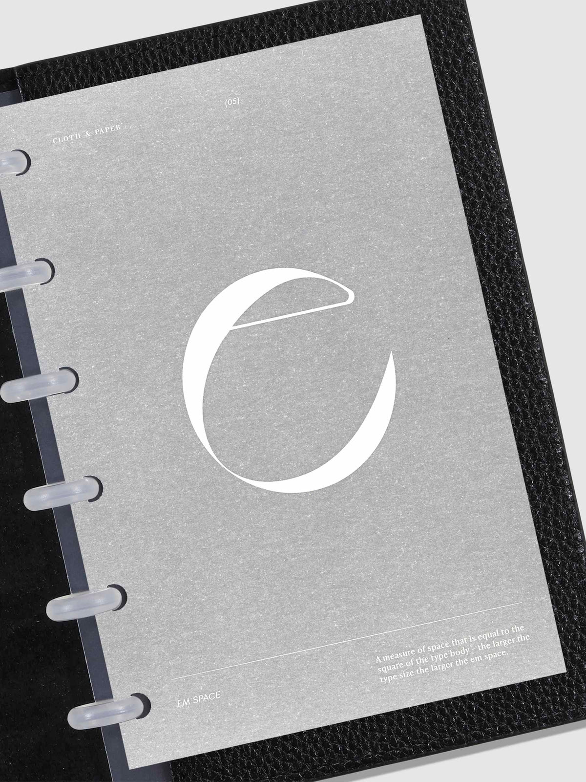 Monogram Vellum Planner Dashboard E in use in a leather planner.