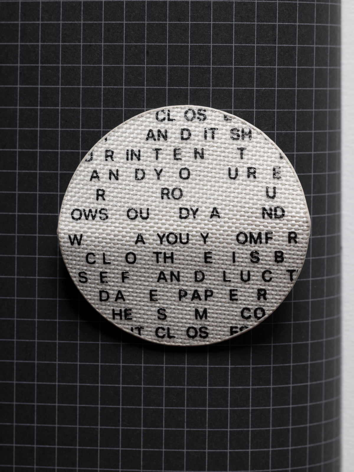 Magnetic Bookmark | Bookcloth | Letters unfolded displaying the bookcloth material and type design.