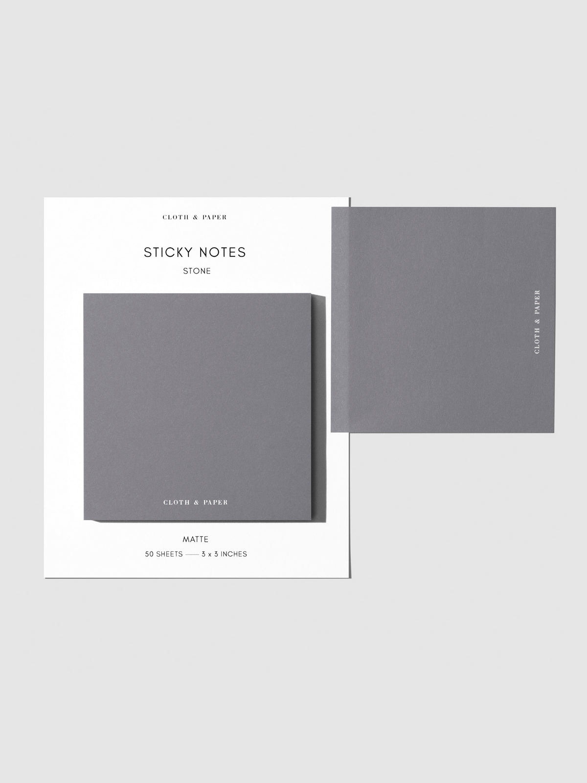 Sticky note set displayed against a neutral background. One note is placed on the packaging's edge. Color shown is Stone.