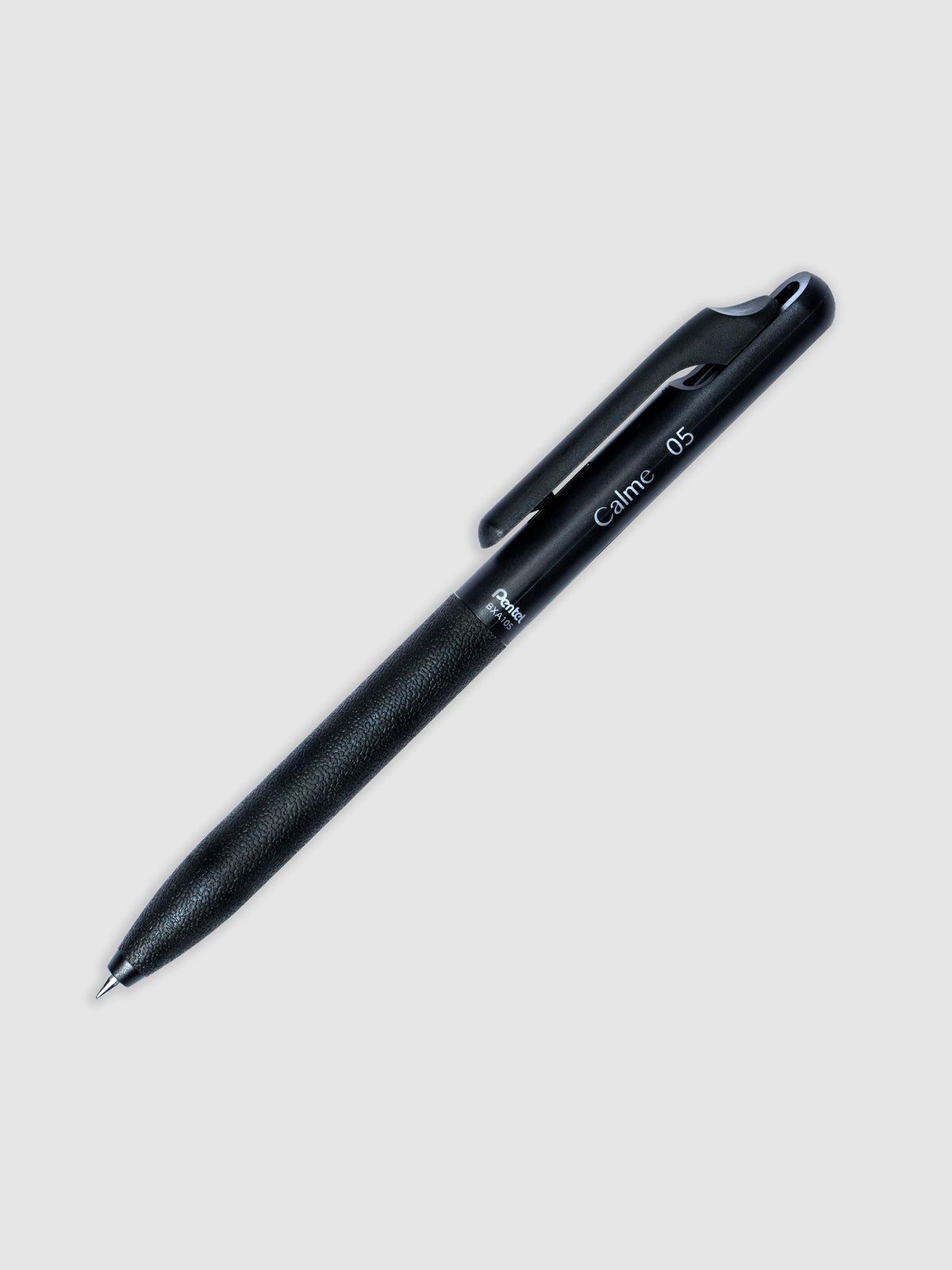 Black pen turned to the right against a neutral background.