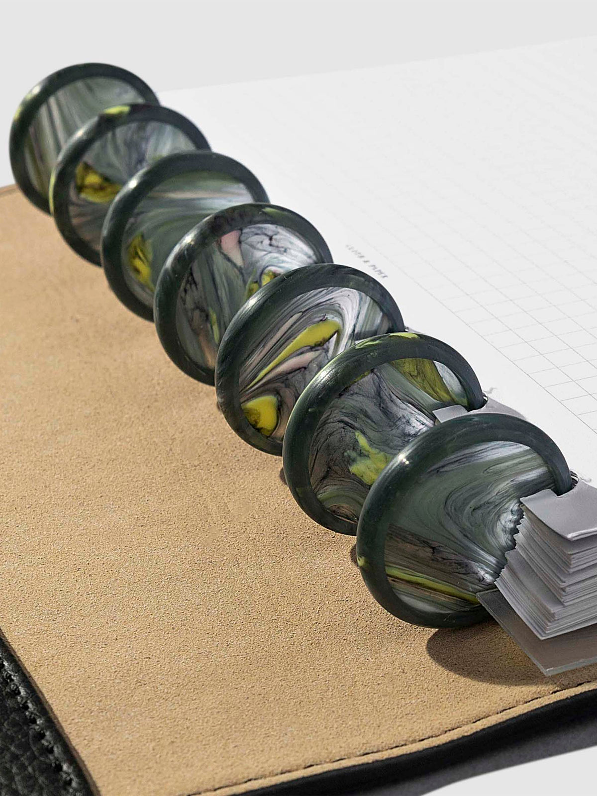Set of 7 discs in use inside a leather folio.