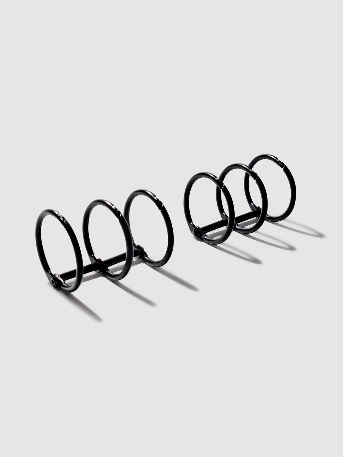 Planner Rings, Cloth and Paper. Black rings displayed on a neutral background.