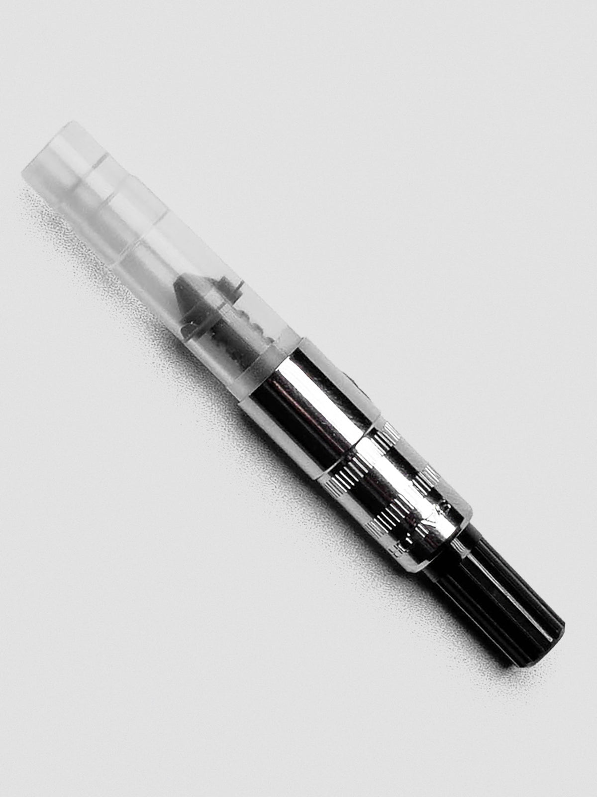 Sailor Mini Ink Converter shown capped with compact clear barrel and silver fittings.
