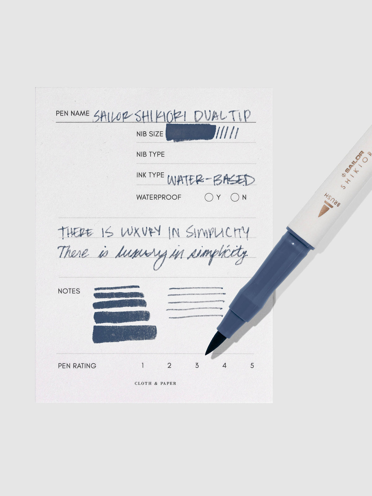 Pen displayed next to in use pen test sheet. Color pictured is Shimoyo.