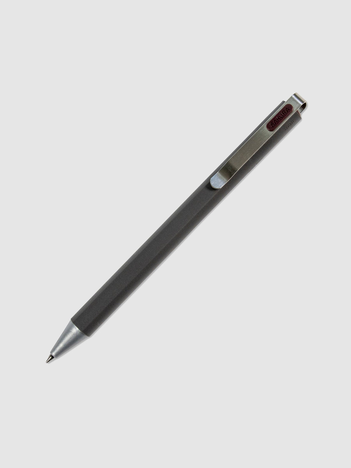 Pen in Red Black turned to the right against a neutral background.