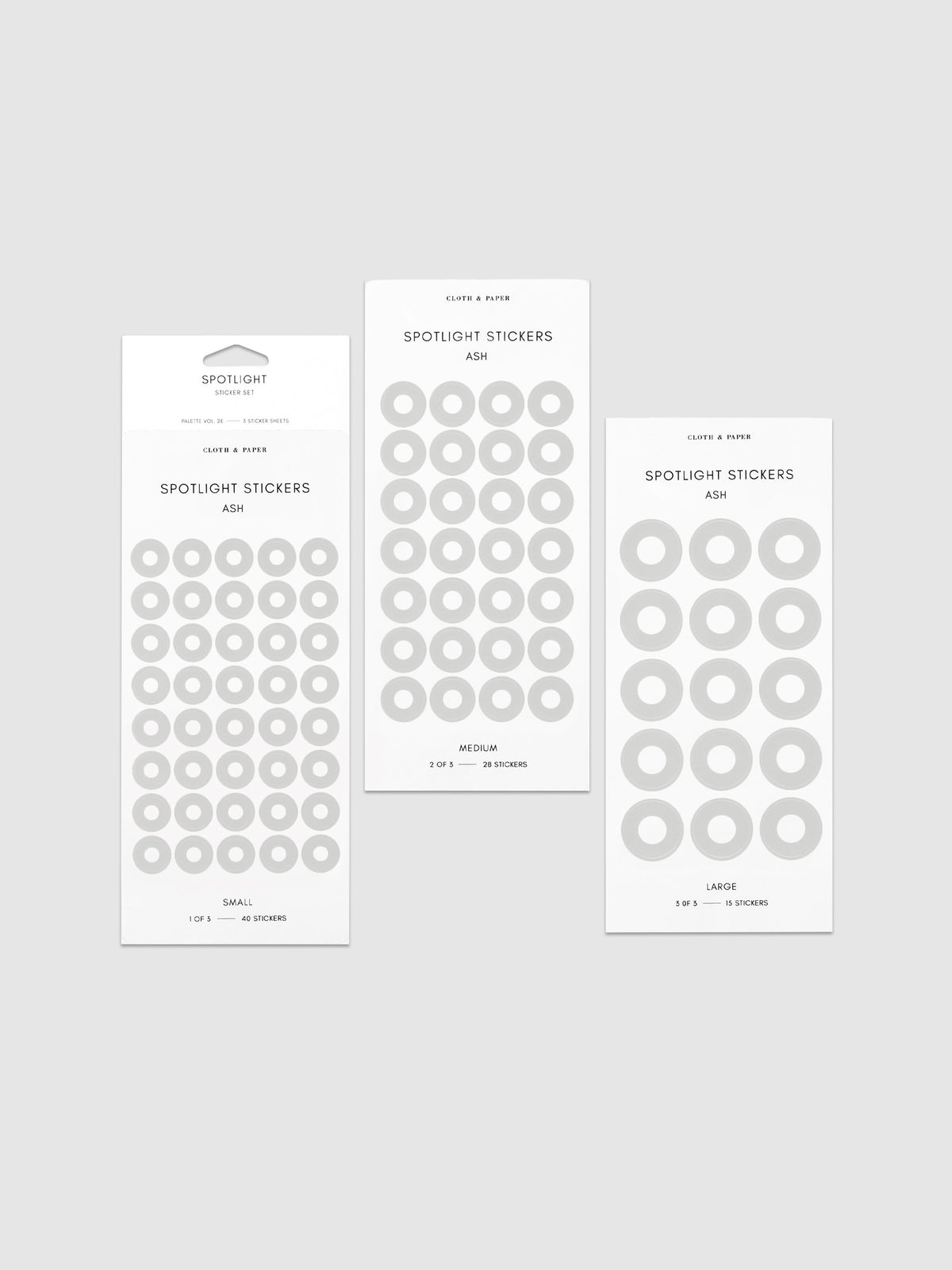 Three sheets of spotlight stickers in small, medium, and large sizing arranged together on a neutral background.