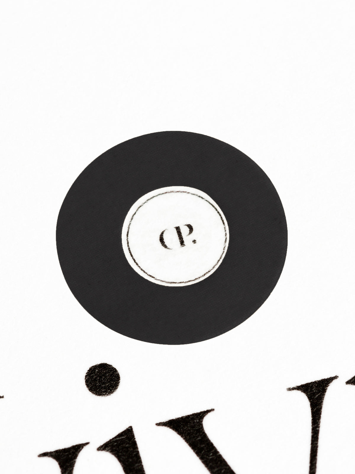 Medium sticker in use, placed over the Cloth and Paper logo on a sheet of paper.