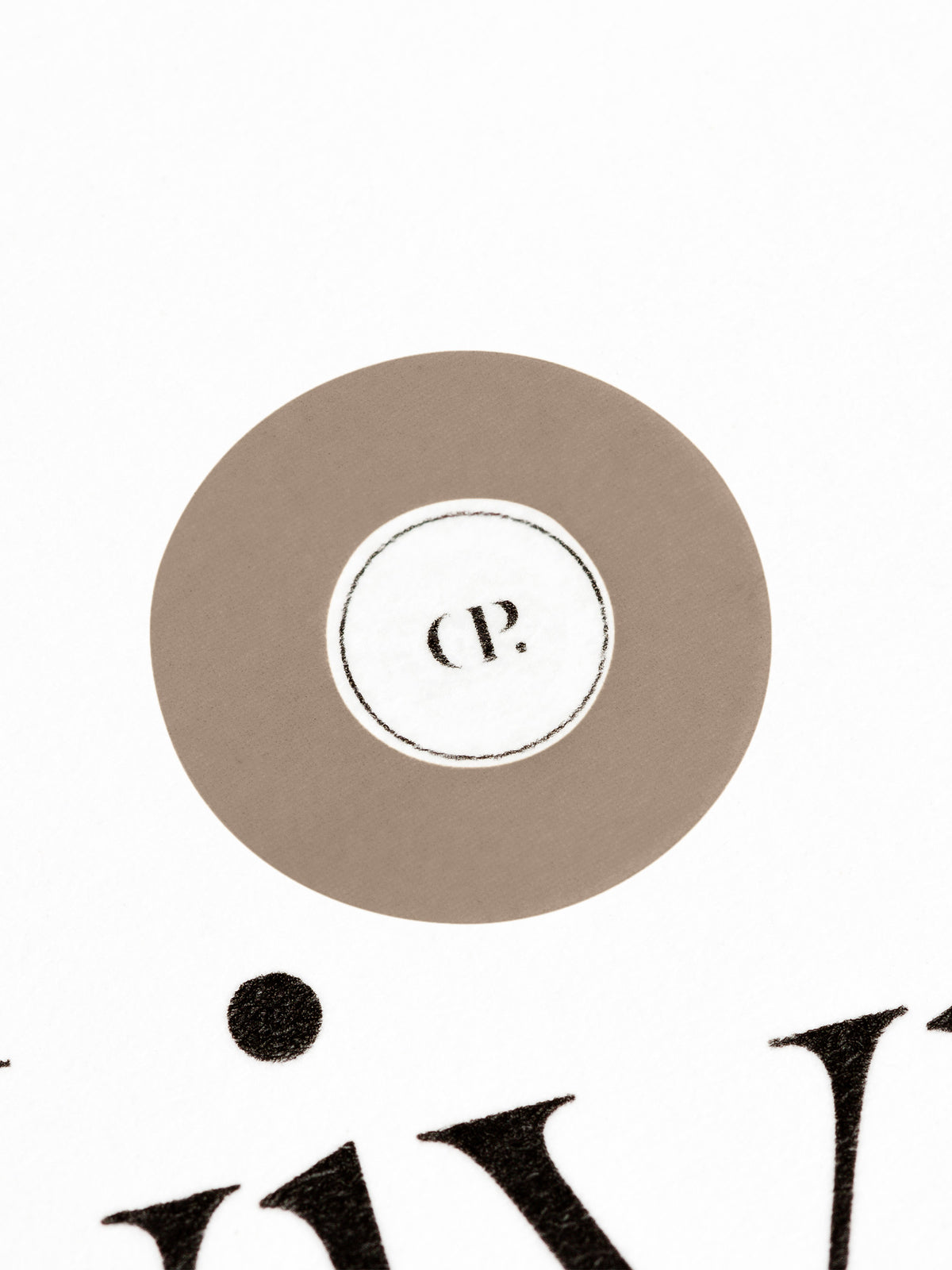 Medium sticker in use, placed over the Cloth and Paper logo on a sheet of paper.