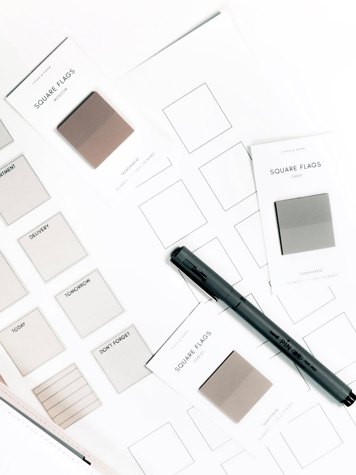 Square Page Flag Printable | Essentials pages layered with Square Page Flags on their backings, Uni Pin Marking Pen, and planner.