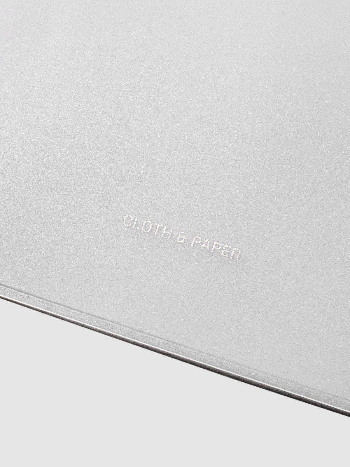 Closeup of Cloth and Paper logo printed on bag.