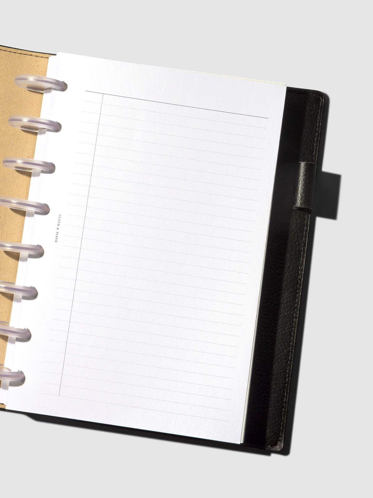 An insert staged inside a leather folio.