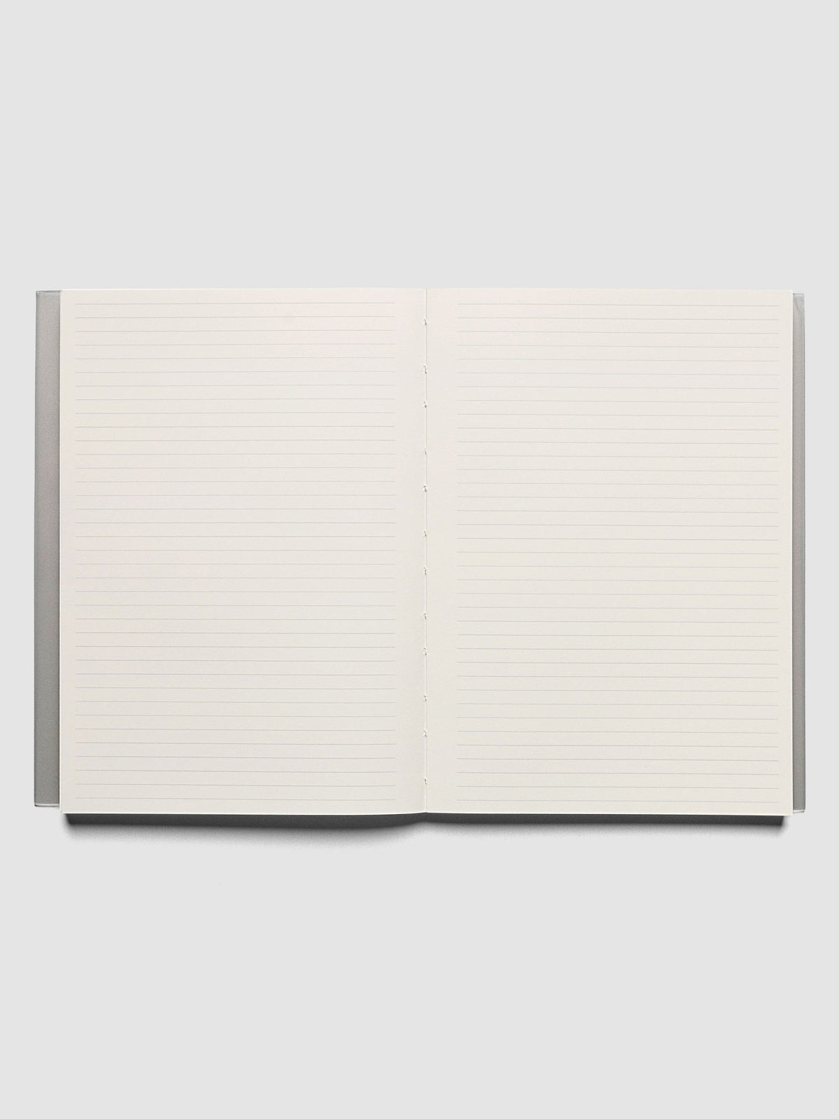 Perfect Bound Notebook | A5 | Lined | Ash shown open, laid flat, on a neutral background. Both pages have a lined notes layout.