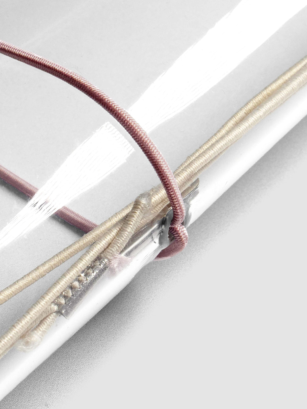 Close up image of the pink exterior band in use with a vinyl cover