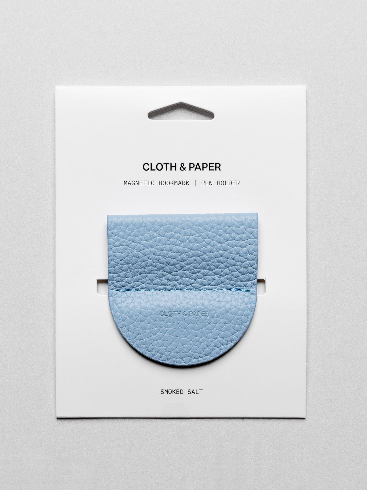 Magnetic Bookmark | Pen Holder in color Smoked Salt (light blue) shown in packaging.