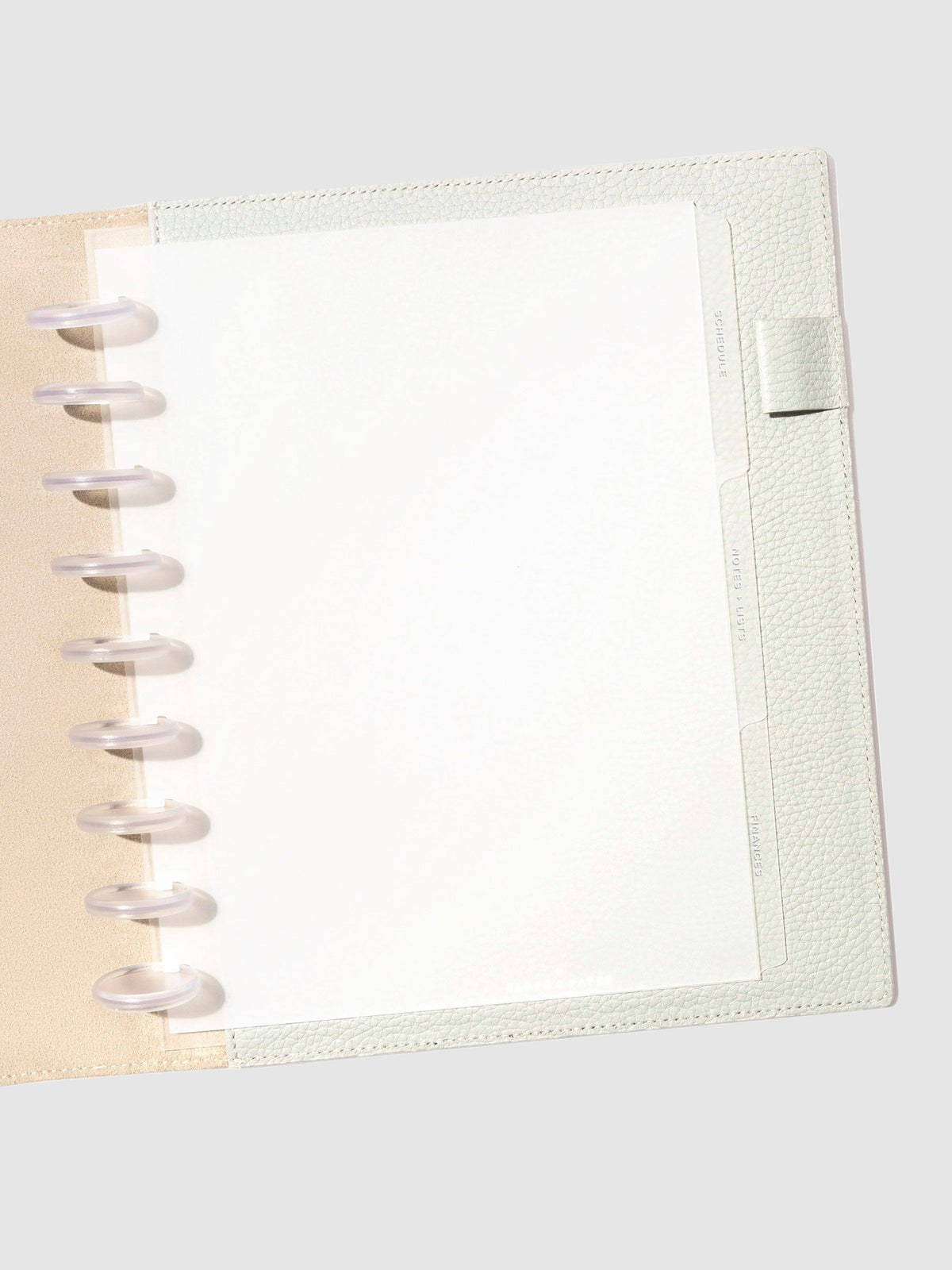 White foil tabs displayed in use inside a leather folio.