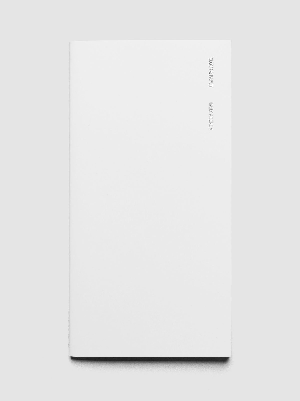 Travel Notebook | A5 Slim | Aspen | Daily Agenda shown closed on a neutral background.