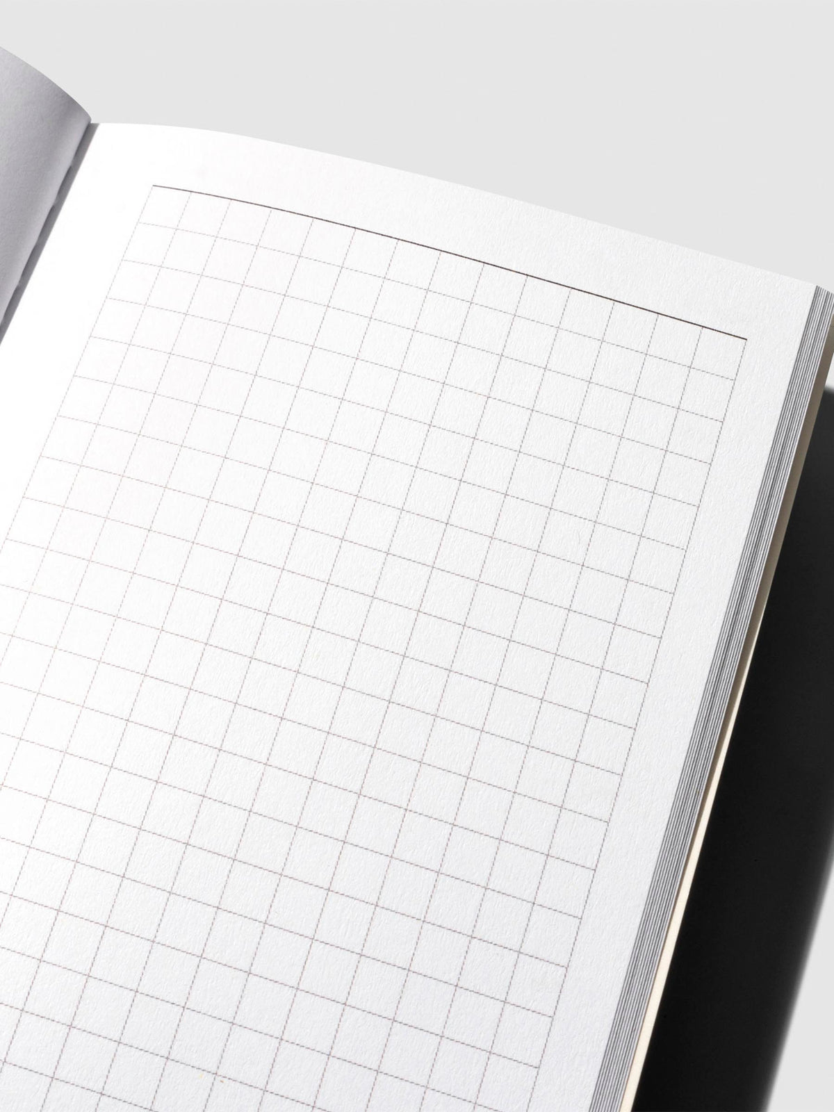 Close-up of the notes page in the Travel Notebook | Pocket Plus | Weekly Hobonichi Style, displaying a clean grid layout for notes or sketches.