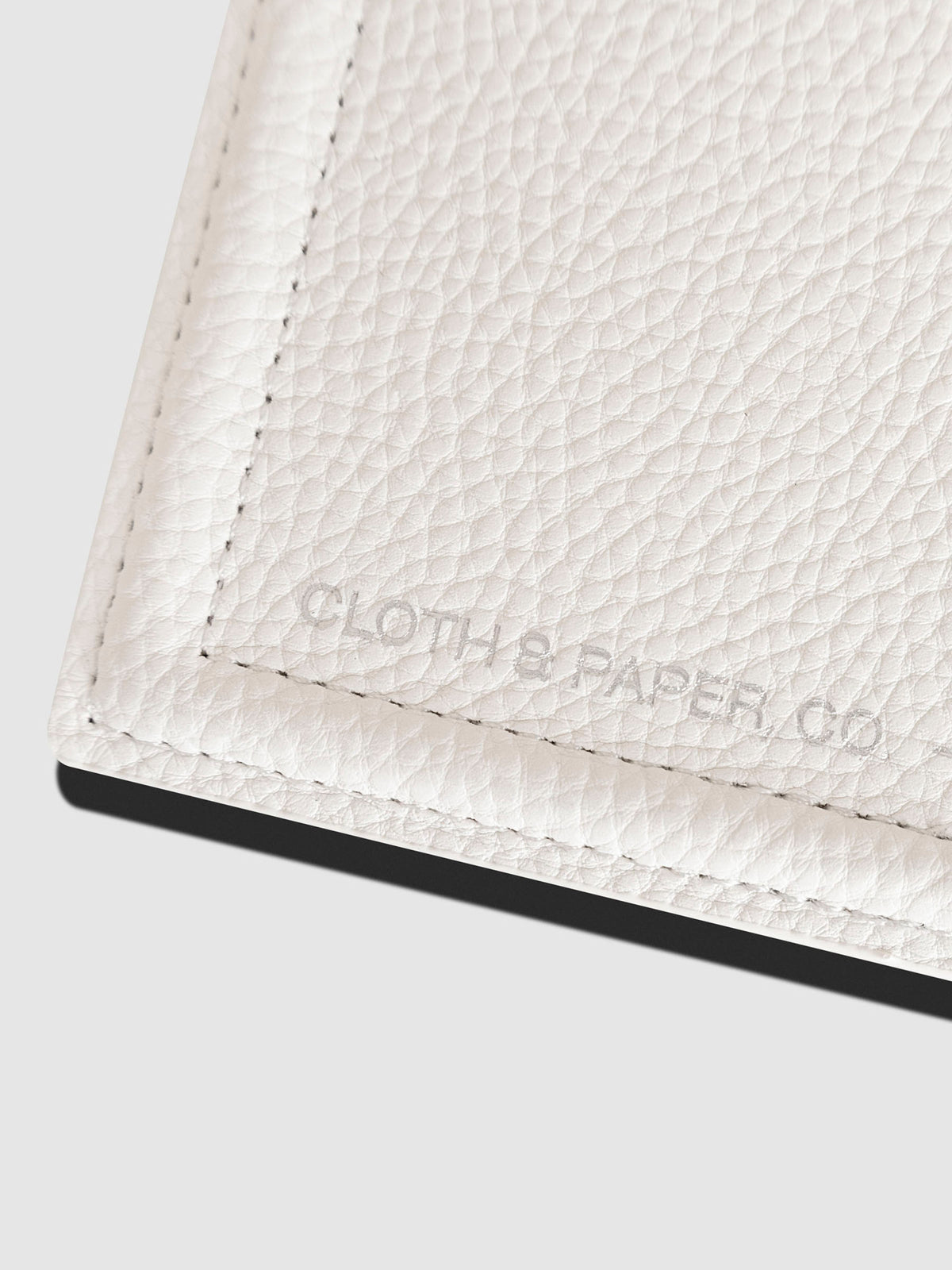 Closeup of tray showing silver embossed Cloth and Paper logo.