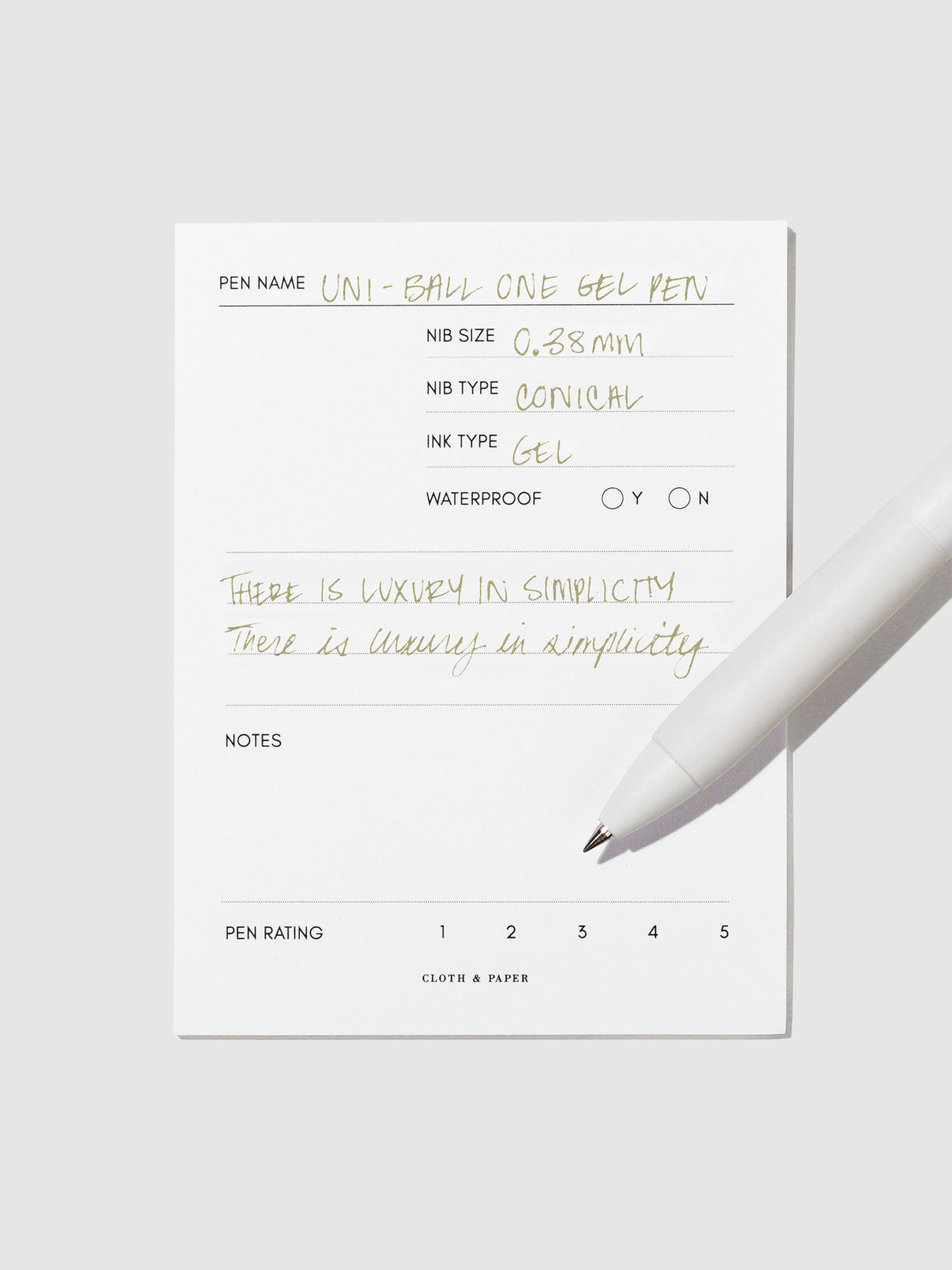 Pen tilted slightly to the right on a neutral background. Color pictured is Avocado Green.