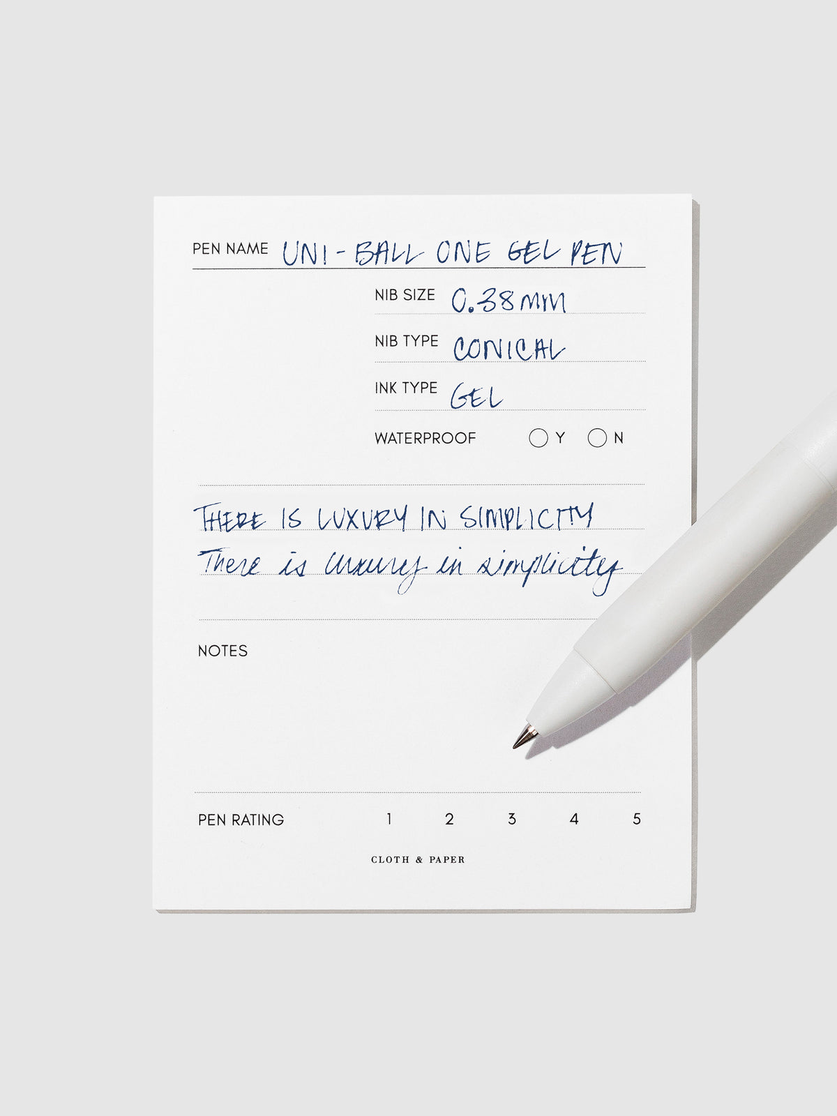 Pen tilted slightly to the right on a neutral background. Color pictured is Blue Black.
