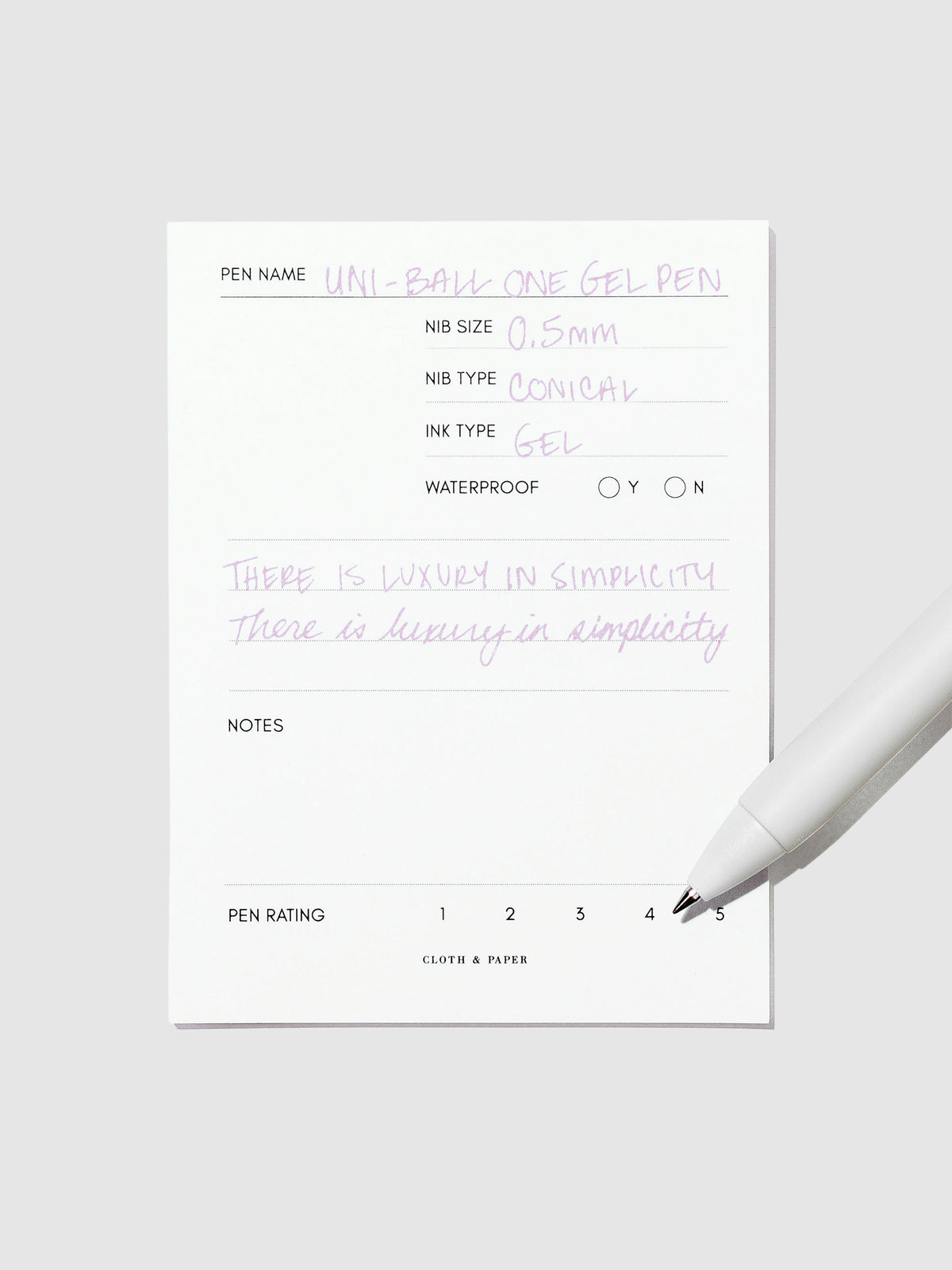 Pen tilted slightly to the right on a neutral background. Color pictured is Plum Purple.