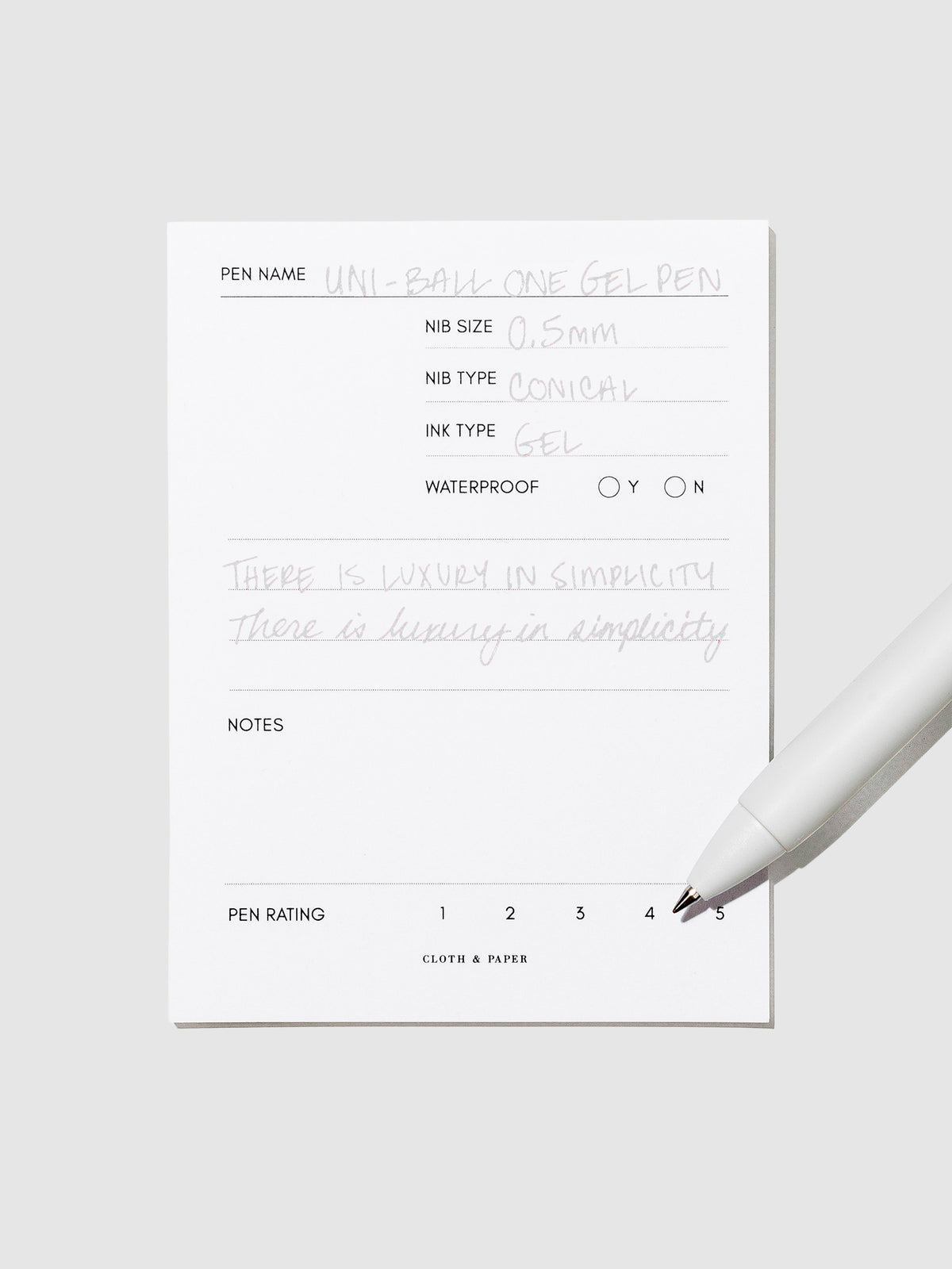 Pen tilted slightly to the right on a neutral background. Color pictured is Sesame Gray.