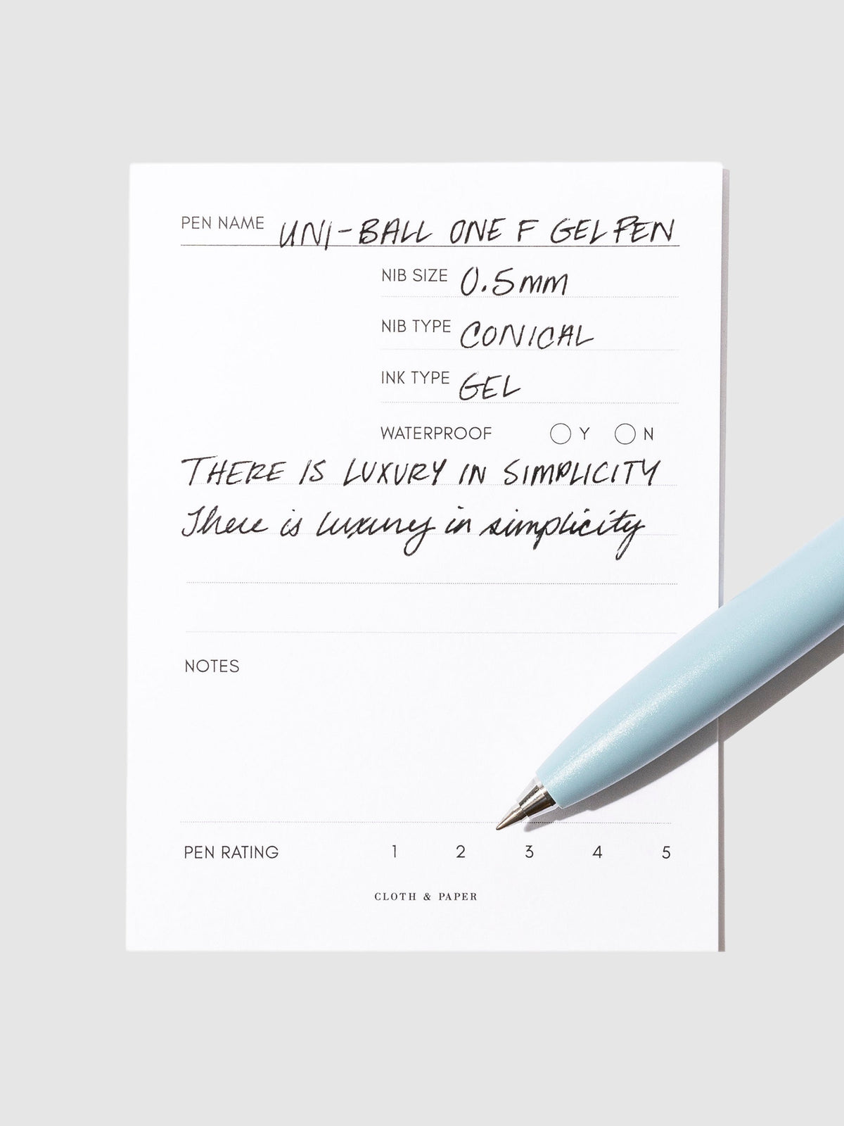 Blue pen resting on an in use pen test sheet.