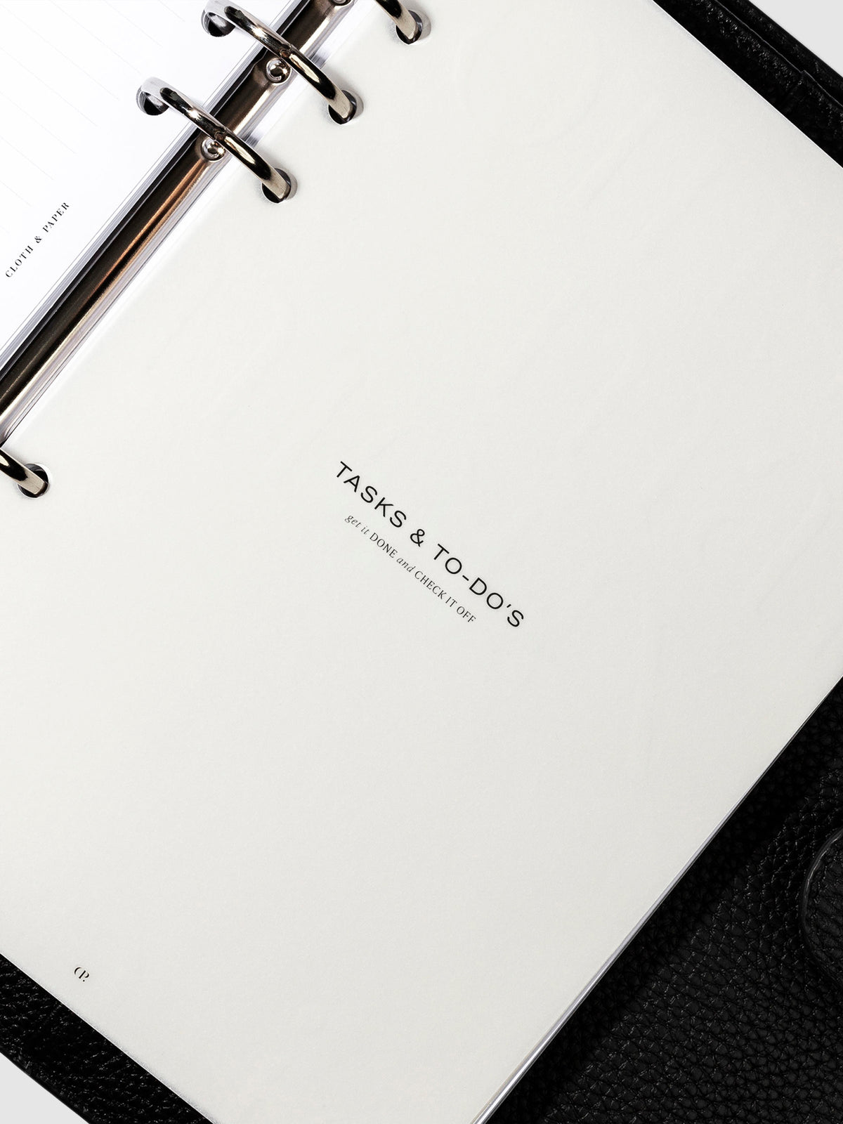 Tasks and To-Do's dashboard in use inside a leather planner.