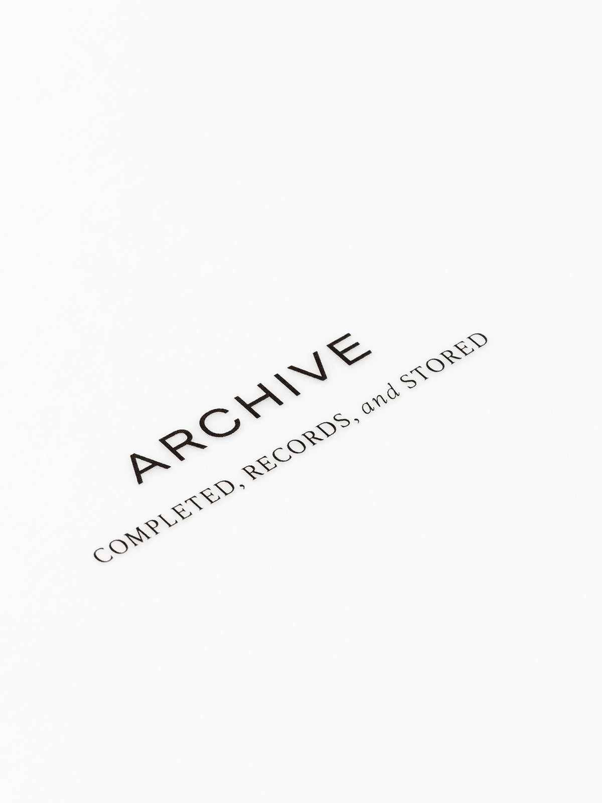 Closeup of text reading "archive | completed, records, and stored"
