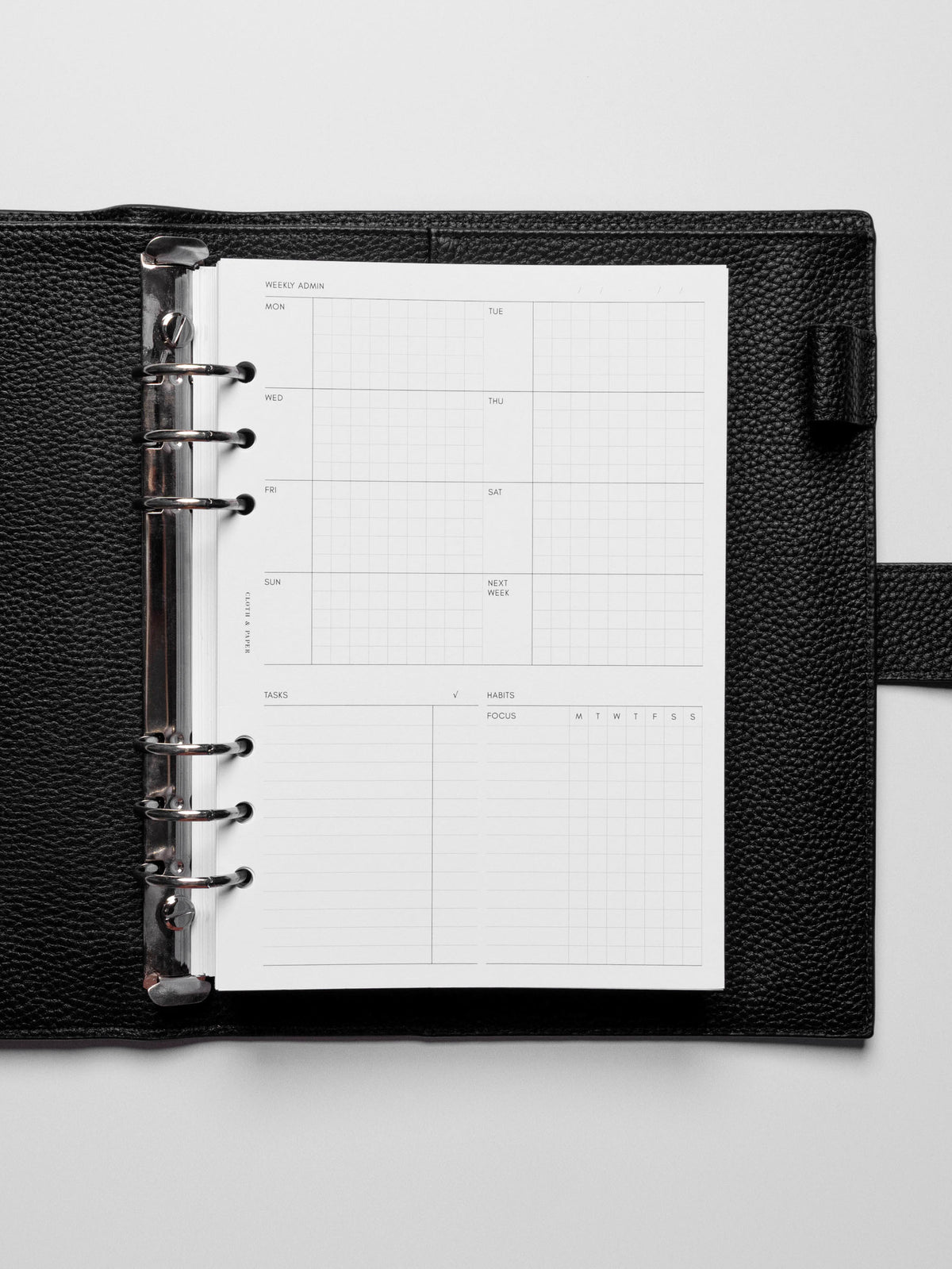 Insert in use inside a black leather planner.