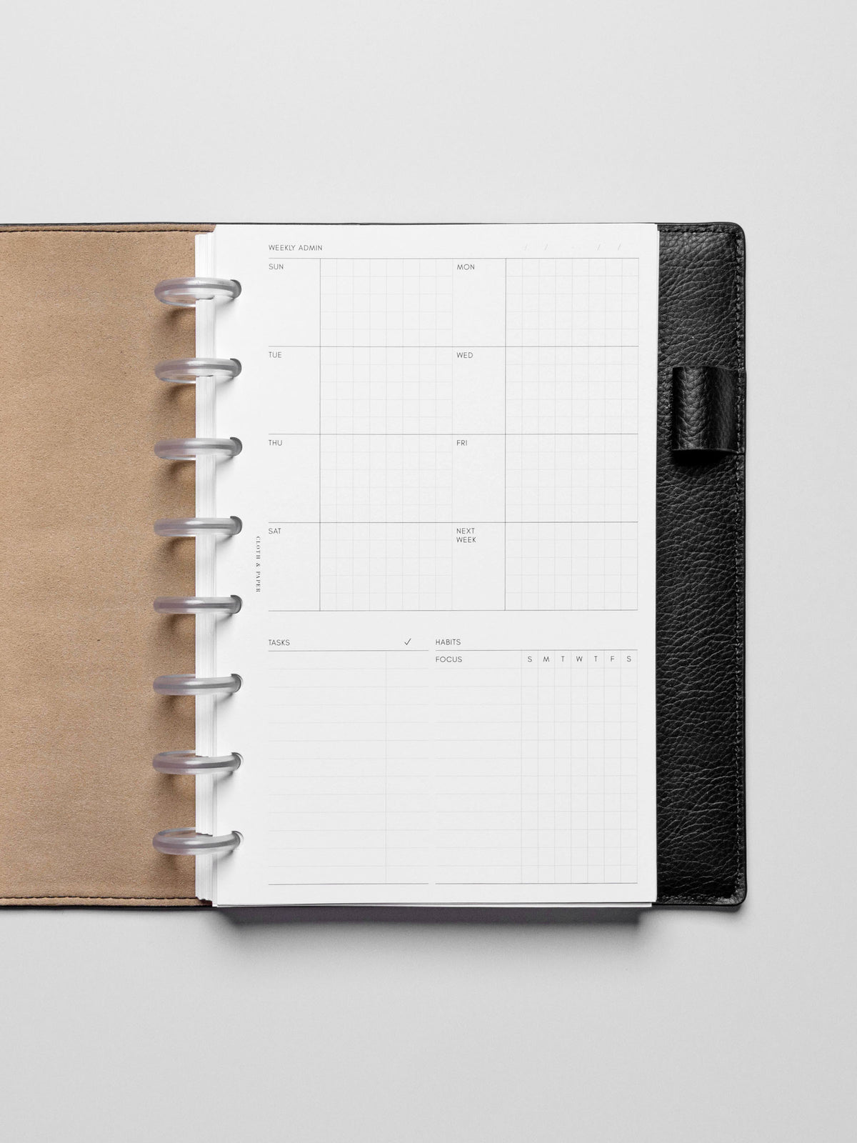 Insert in use inside a black leather planner.