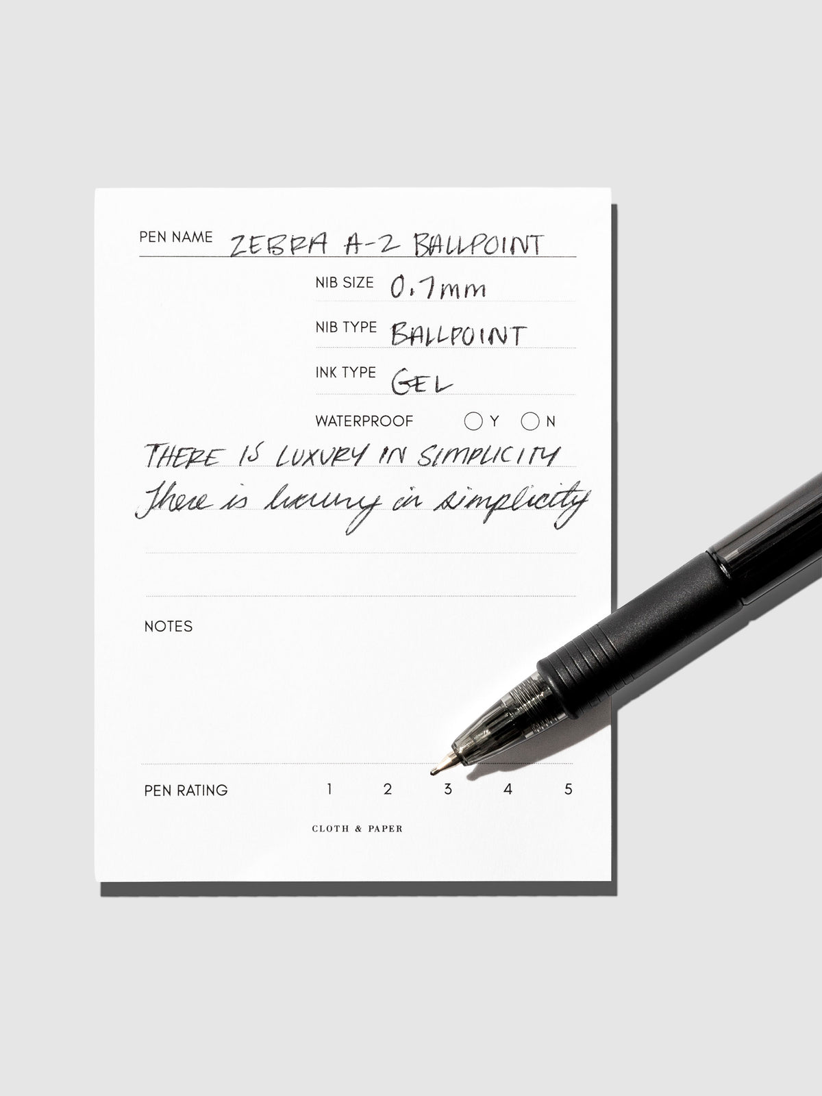 Pen resting on in use pen testing sheet.