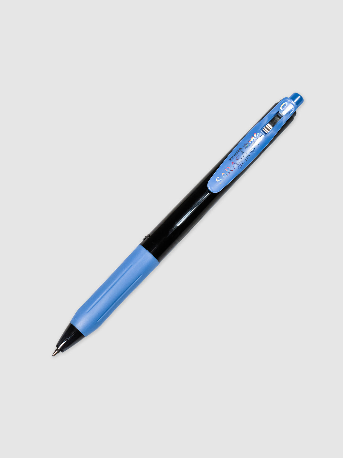 Zebra Sarasa Clip with a 0.5 mm nib in the Decoshine Series in the color Shiny Royal Blue. The pen is turned to the right against a neutral background.