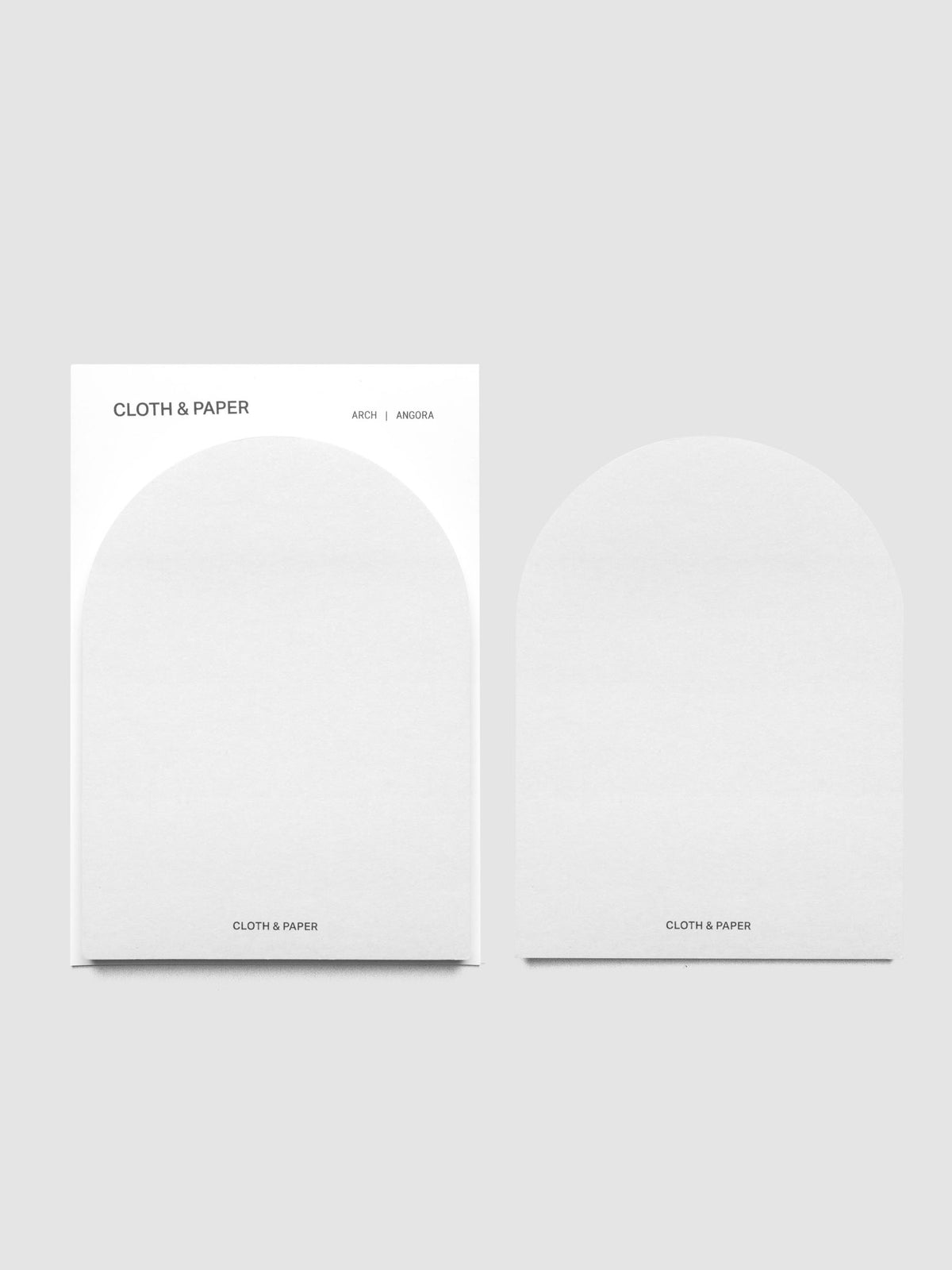 A set of Angora (light gray) Arched Sticky Notes with one peeled off and shown to the side | Cloth & Paper