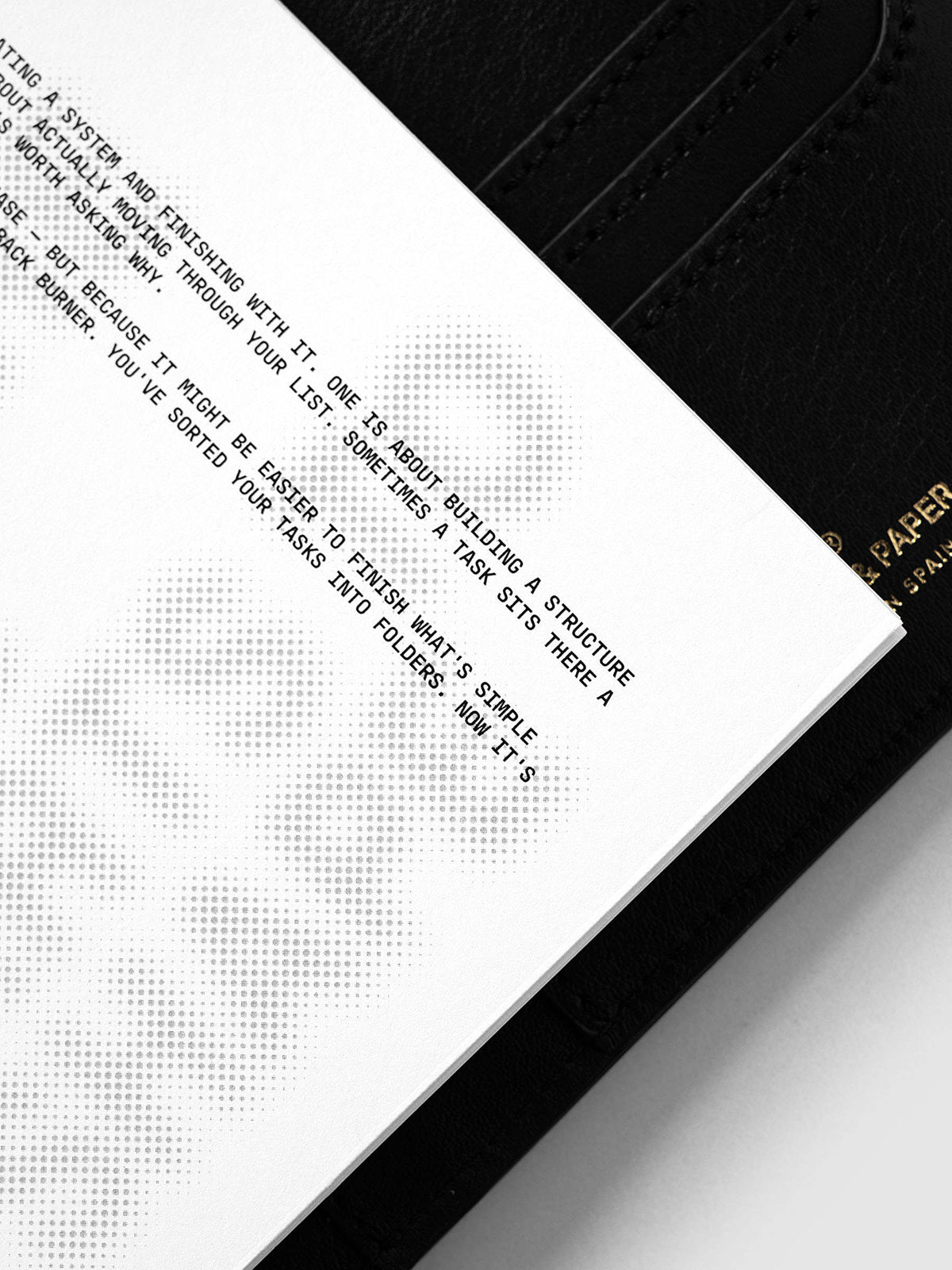 Halftone Planner Dashboard, A5 6-Ring Punch, angled close-up of the black typewriter passage beside the halftone headline