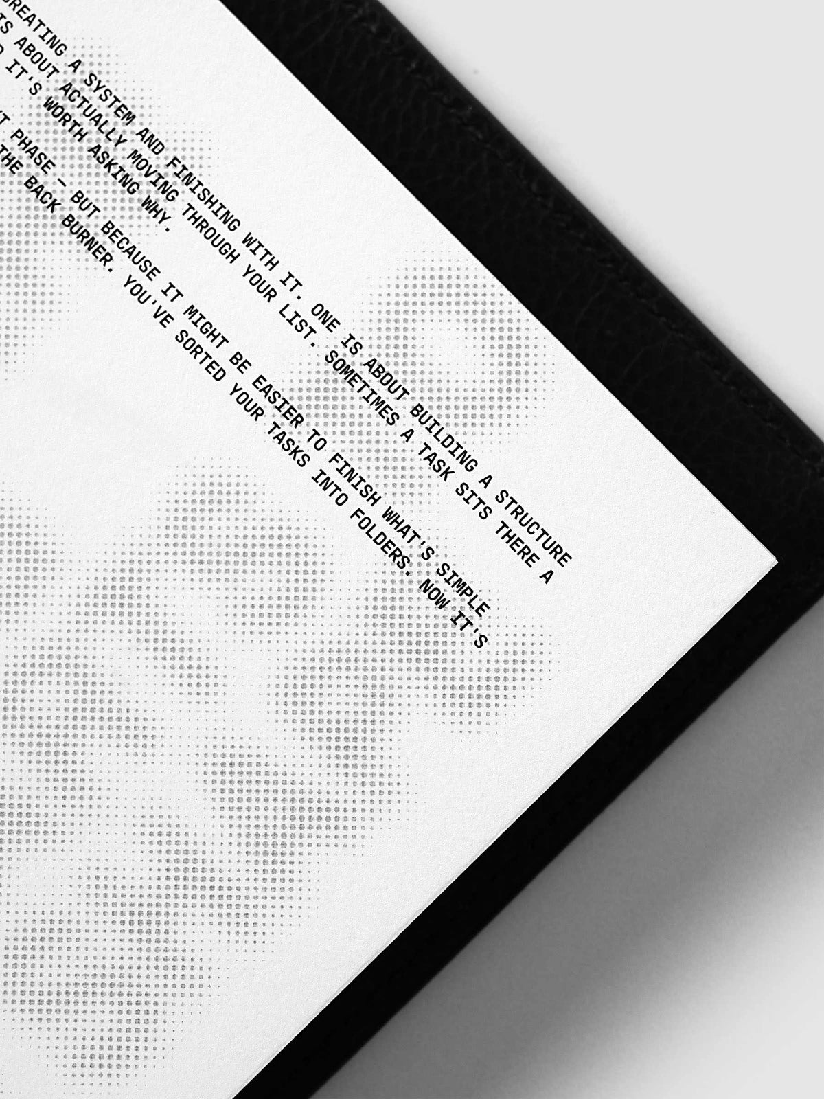Halftone Planner Dashboard, Half Letter 8-Disc Punch, angled close-up of the black typewriter passage beside the halftone headline